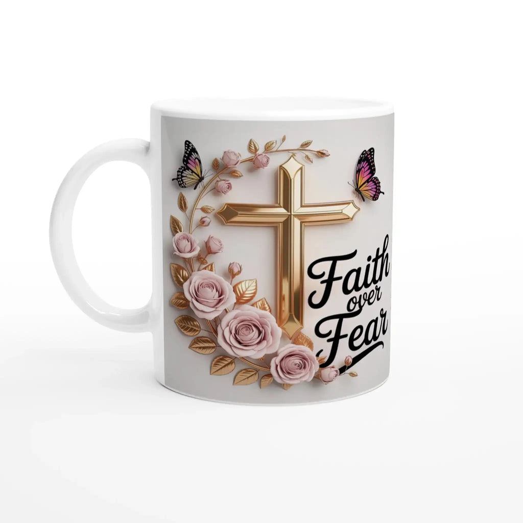 Close-up of faith-themed ceramic mug with pink roses, butterflies, and gold cross, on a wooden table with plants