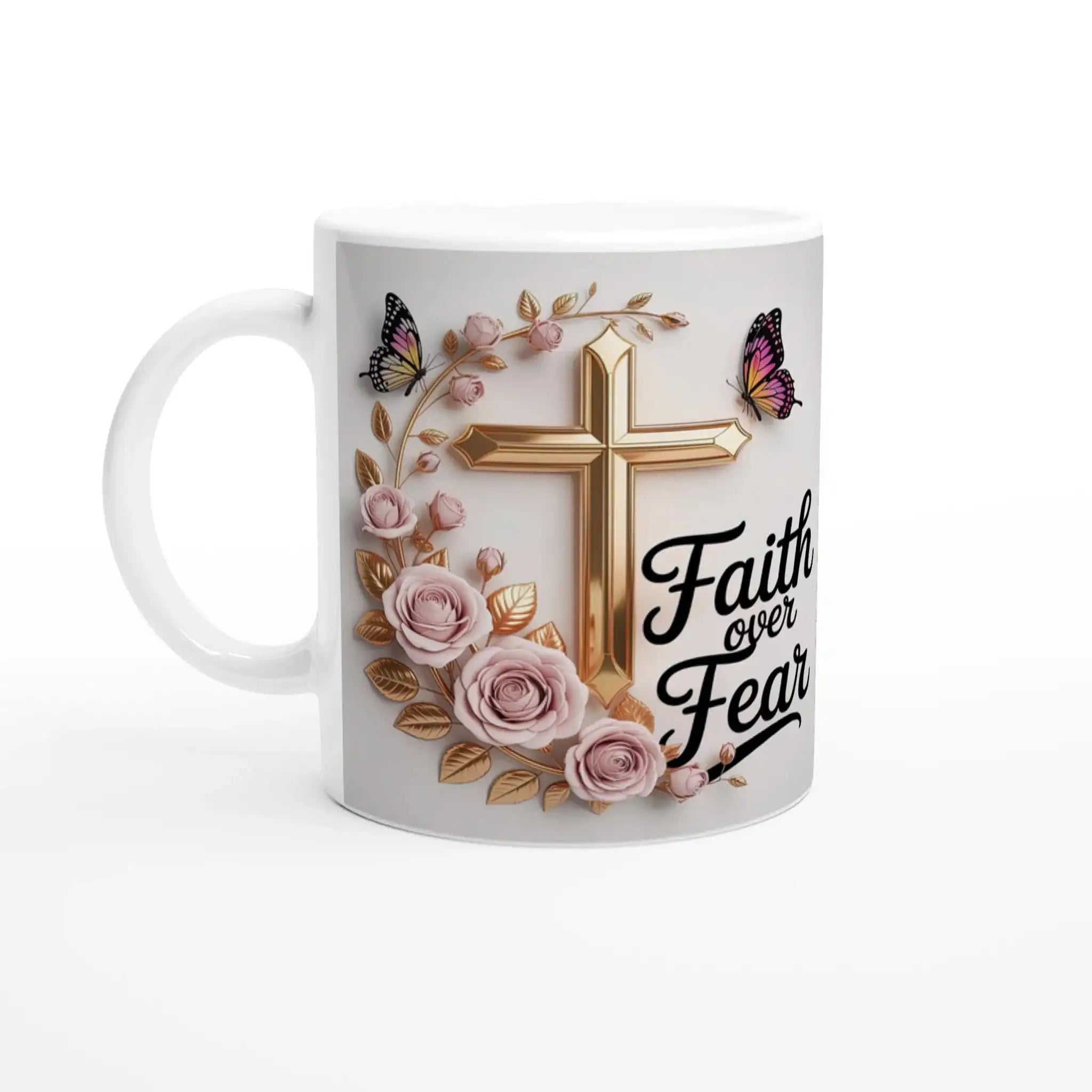 Close-up of faith-themed ceramic mug with pink roses, butterflies, and gold cross, on a wooden table with plants