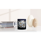 Side view of floral ceramic mug on white background