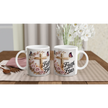 White ceramic mug with faith-themed design, pink roses, butterflies, and gold cross, on a wooden table with plants