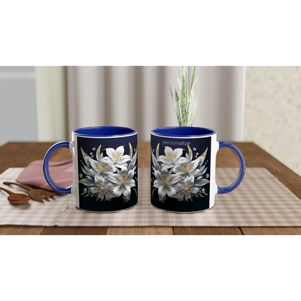 Ceramic mug with floral design and blue handle