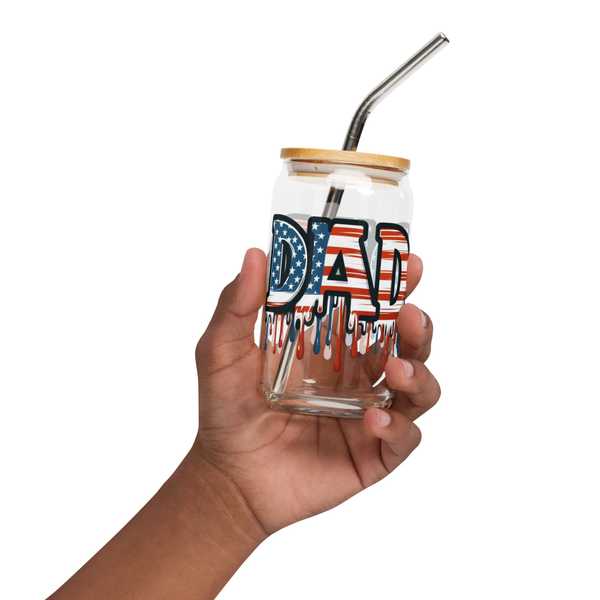 Hand holding patriotic Dad glass with lid and straw