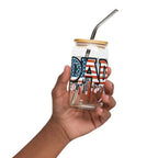 Hand holding patriotic Dad glass with lid and straw