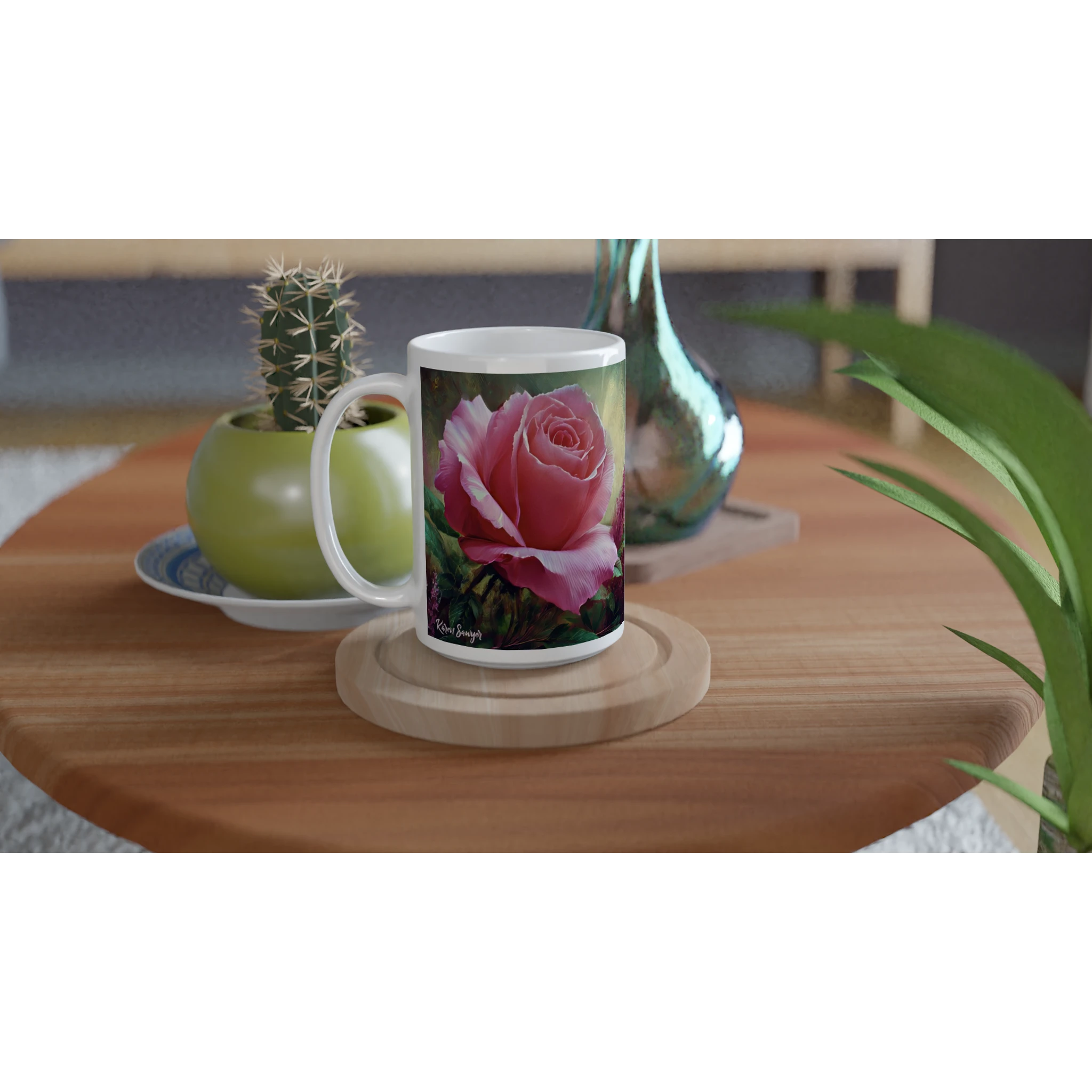 Two floral mugs on wooden table with plants