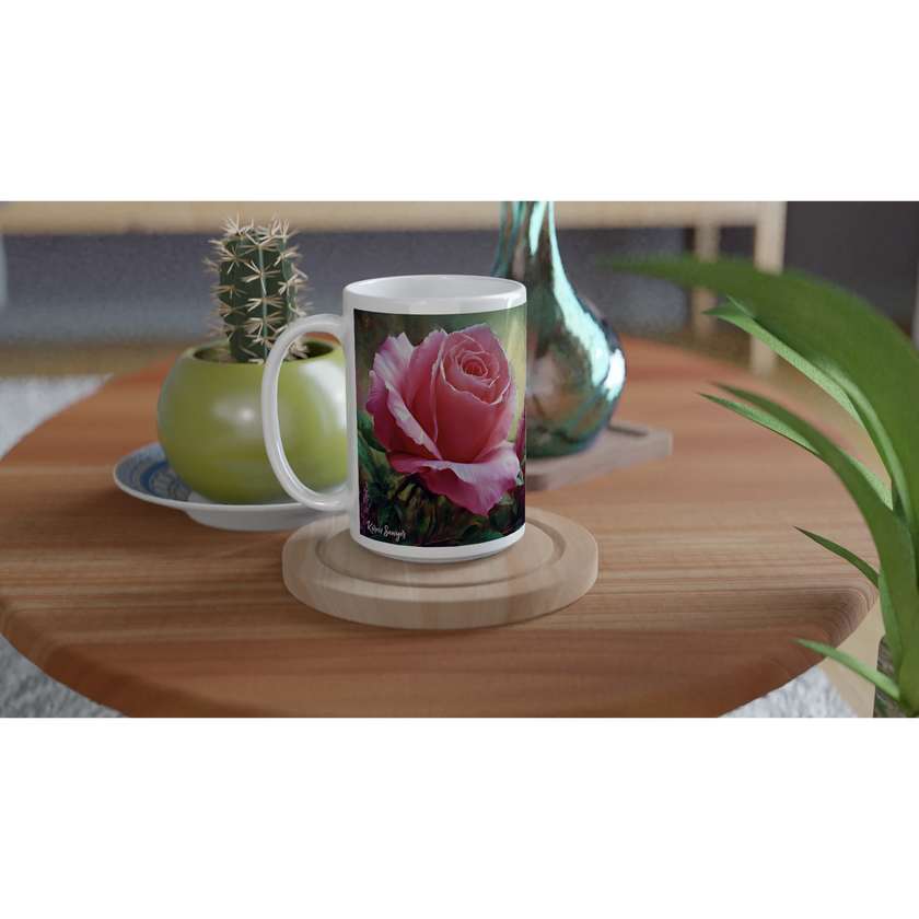 Two floral mugs on wooden table with plants