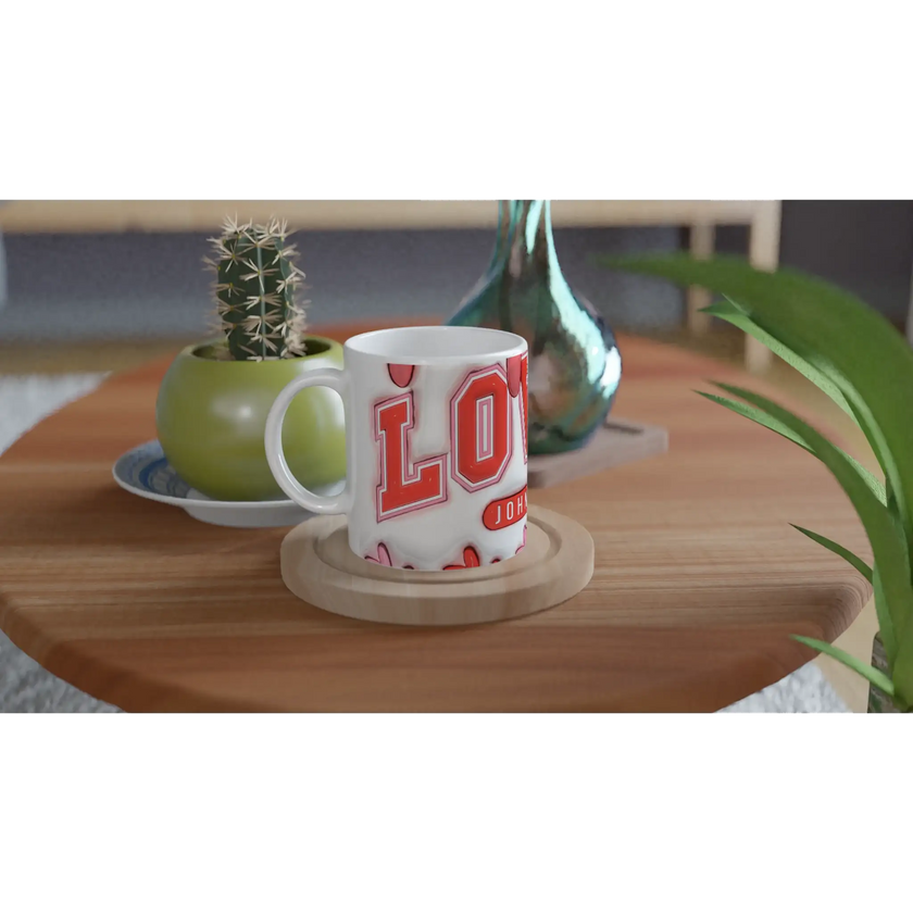 White mug with red lettering on wooden table