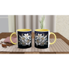Ceramic mug with floral design and blue handle